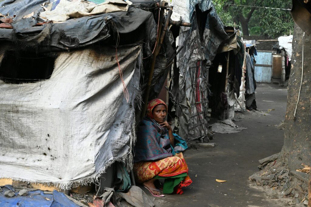 Woman Sitting in front of Tent